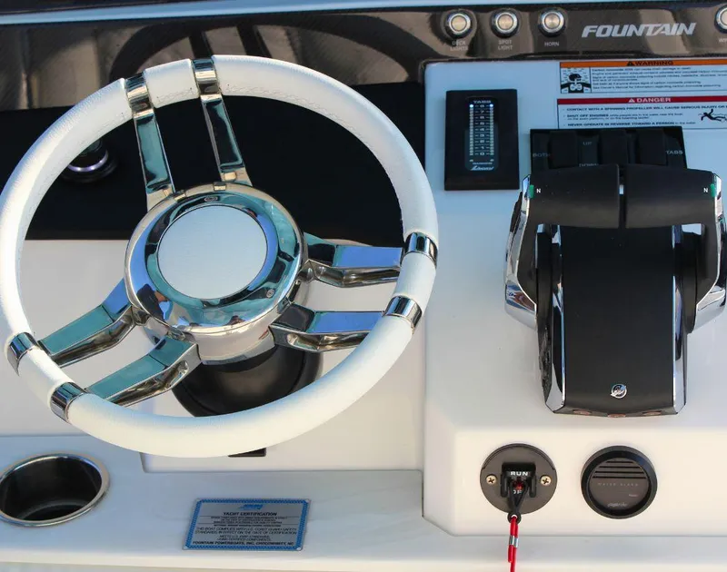 Slide: The Image of Steering wheel and controls of 2025 Fountain 38 SCX boat. - 15