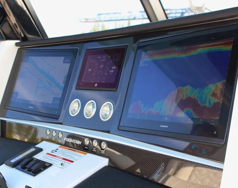 Slide: The Image of 2025 Fountain 38 SCX dashboard with advanced navigation and control screens. - 16