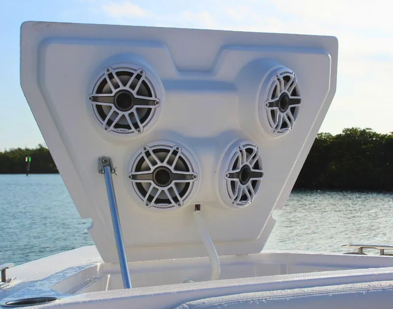 Slide: The Image of Speakers on a 2025 Fountain 38 SCX boat, open hatch, scenic water backdrop. - 25