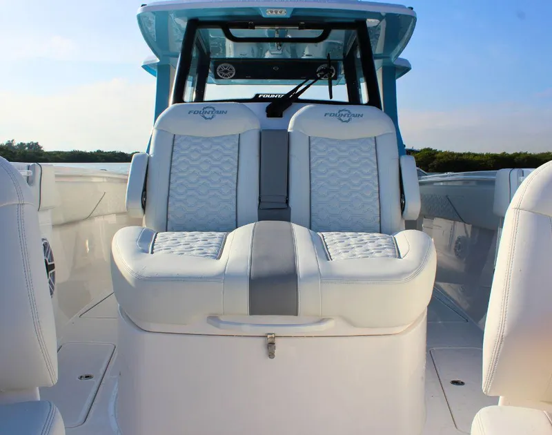 Slide: The Image of 2025 Fountain 38 SCX boat interior with luxurious white seating and modern design. - 26