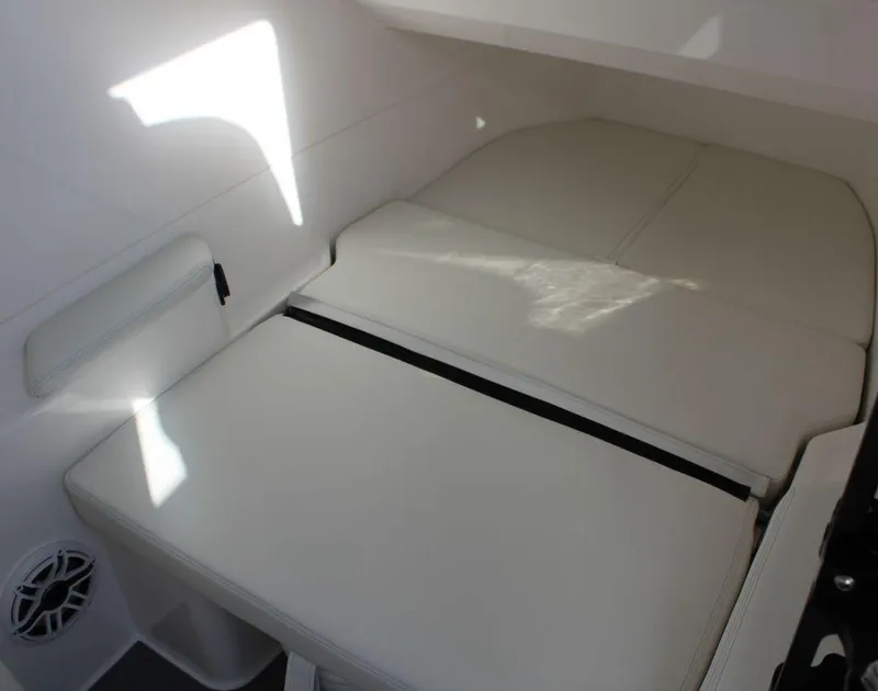 Slide: The Image of Interior cabin of 2025 Fountain 38 SCX boat with cushioned seating. - 29
