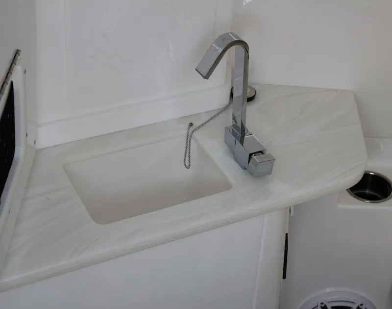 Slide: The Image of Modern sink and faucet in 2025 Fountain 38 SCX boat interior. - 30