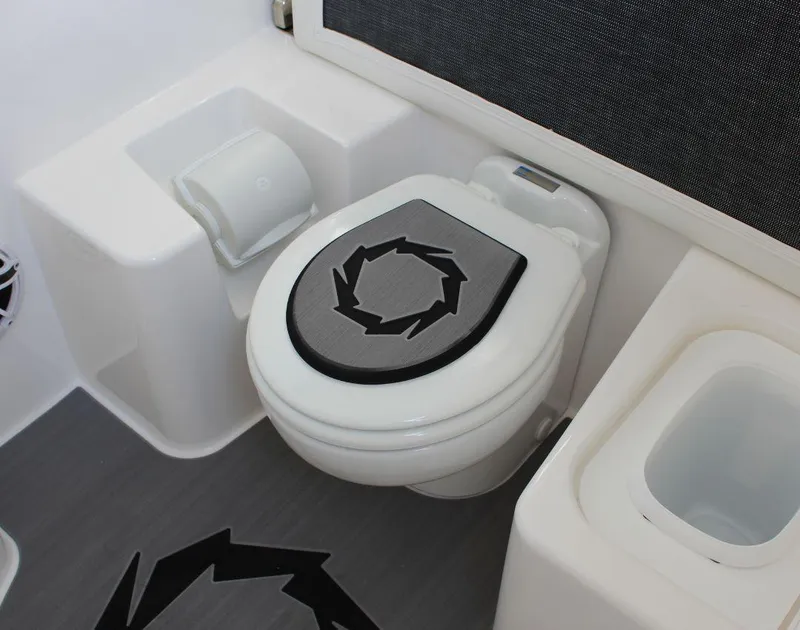 Slide: The Image of 2025 Fountain 38 SCX boat bathroom with modern toilet and sleek design. - 31