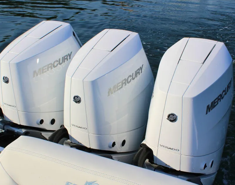 Slide: The Image of Triple Mercury Verado outboard engines on a 2025 Fountain 38 SCX boat. - 7