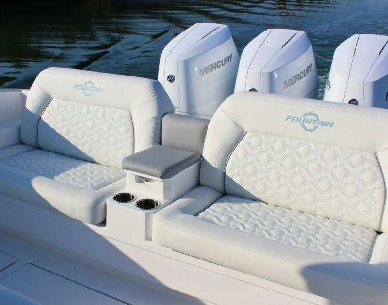 Slide: The Image of 2025 Fountain 38 SCX boat with luxurious seating and Mercury engines. - 8