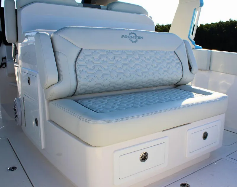 Slide: The Image of 2025 Fountain 38 SCX boat seat with storage compartments, featuring elegant upholstery design. - 9