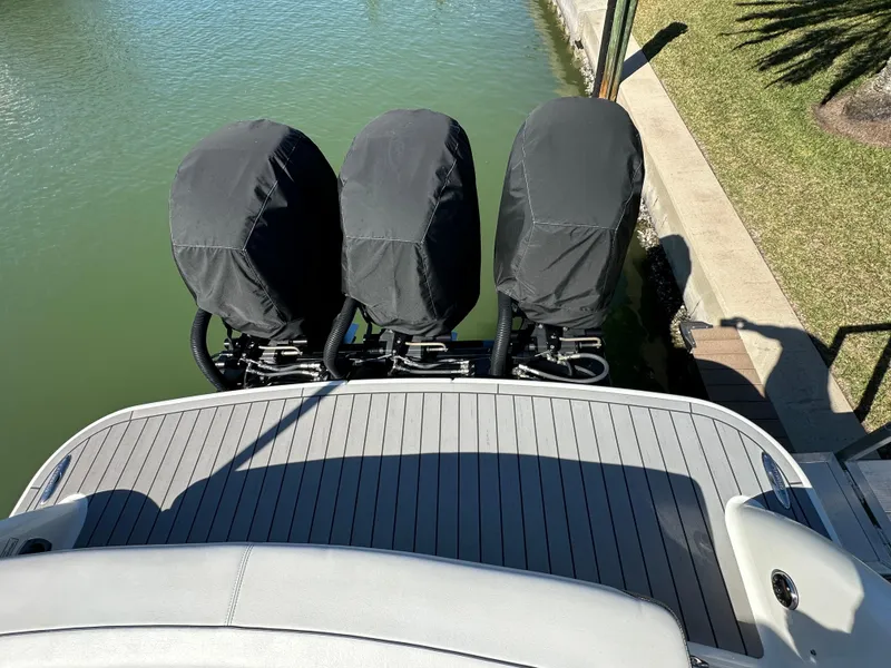Slide: The Image of 2020 Formula 350 Crossover Bowrider OB with triple covered outboard engines. - 11
