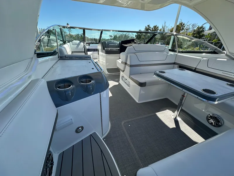 Slide: The Image of 2020 Formula 350 Crossover Bowrider OB interior with seating and table, showcasing luxury design. - 14