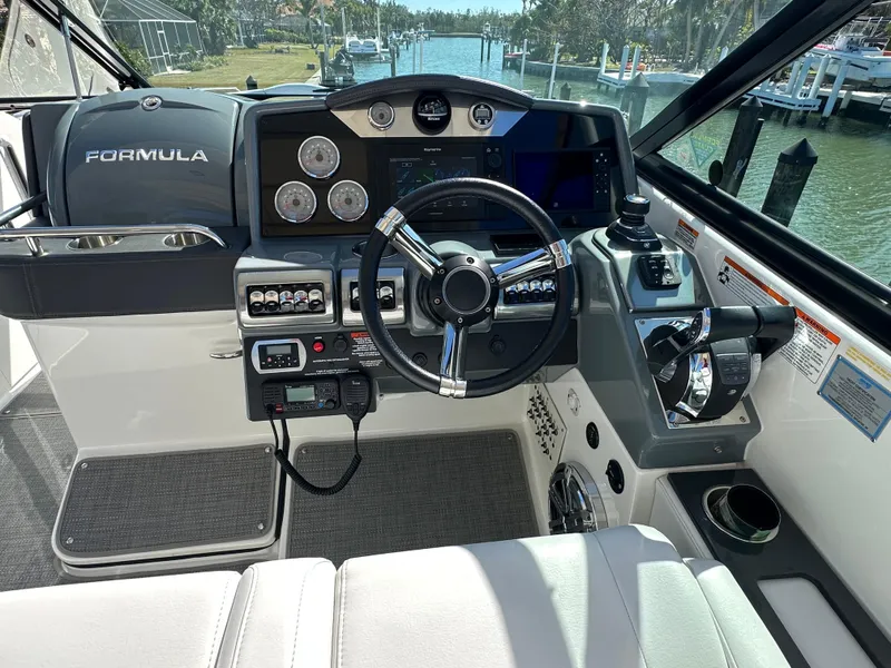 Slide: The Image of Cockpit of 2020 Formula 350 Crossover Bowrider OB with modern controls and steering wheel. - 19