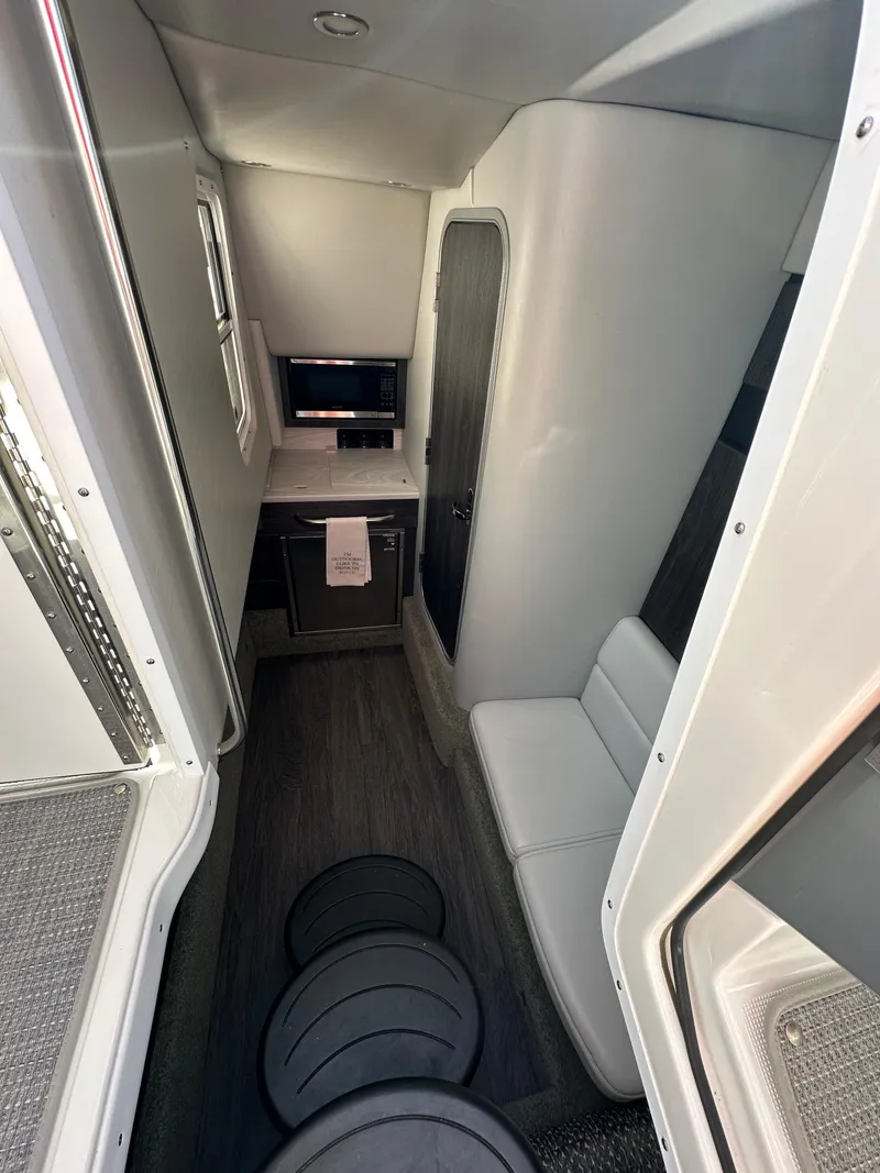 Slide: The Image of 2020 Formula 350 Crossover Bowrider OB interior with seating and kitchenette. - 23