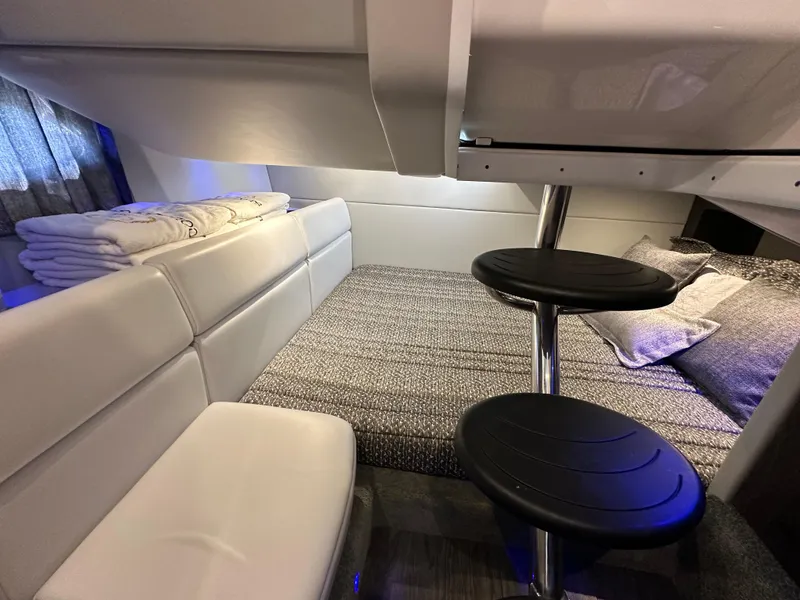 Slide: The Image of 2020 Formula 350 Crossover Bowrider OB cabin interior with seating and bedding. - 27