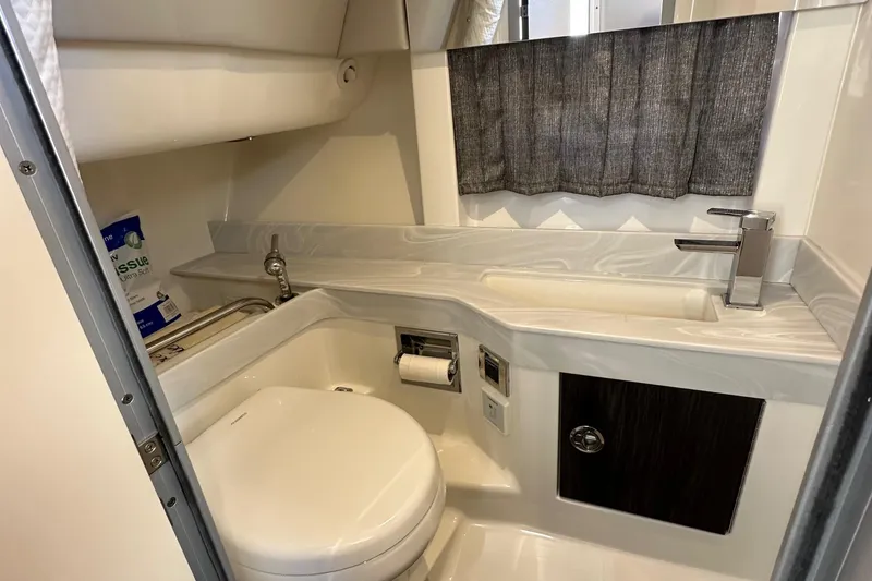 Slide: The Image of 2020 Formula 350 Crossover Bowrider OB bathroom with modern fixtures and compact design. - 29