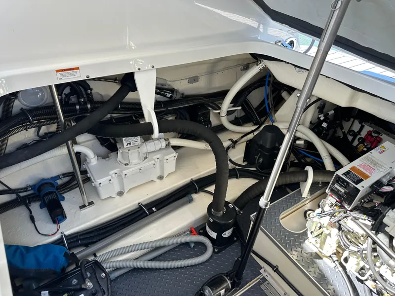 Slide: The Image of Engine compartment of a 2020 Formula 350 Crossover Bowrider OB, showcasing mechanical components. - 32