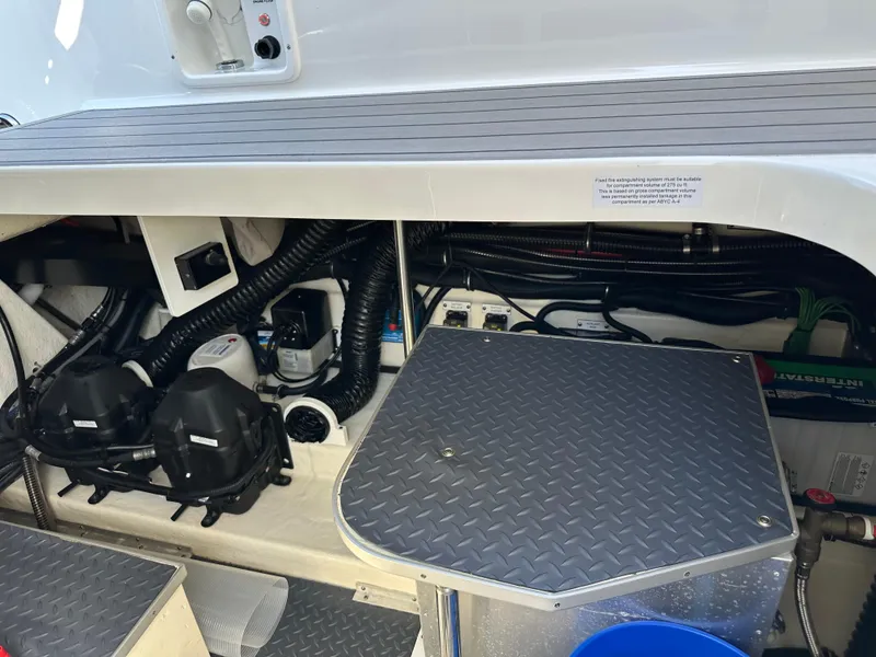 Slide: The Image of Engine compartment of 2020 Formula 350 Crossover Bowrider OB with visible components and wiring. - 33