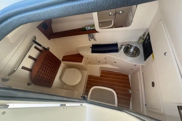 Slide: The Image of 2024 Grady-White Freedom 335 boat interior with open cockpit and seating. - 17