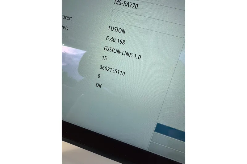 Slide: The Image of 2024 Grady-White Freedom 335 boat interior with covered helm and seating area. - 22