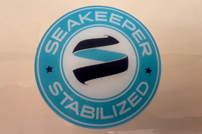 Slide: The Image of 2024 Grady-White Freedom 335 boat interior with sunset view and advanced navigation system. - 23