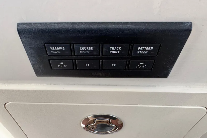 Slide: The Image of 2024 Grady-White Freedom 335 cabin interior with white seating and wood accents. - 26