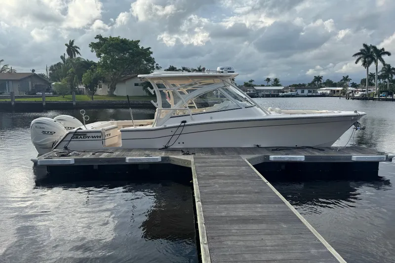 Slide: The Image of Control panel of 2024 Grady-White Freedom 335 boat with navigation and audio systems. - 33