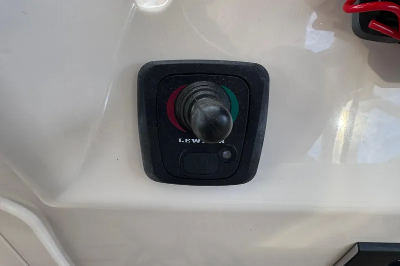 Slide: The Image of Control panel on 2024 Grady-White Freedom 335 boat, featuring joystick and buttons. - 40