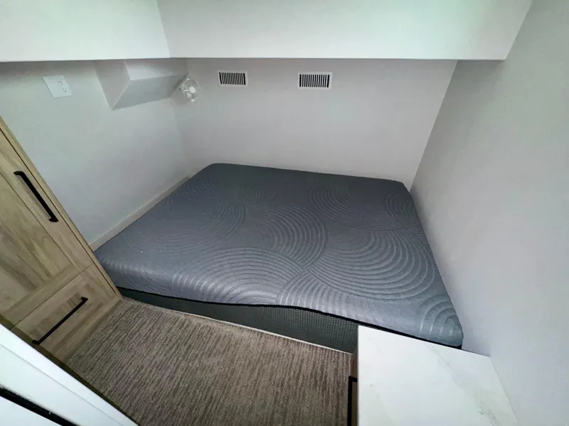 Slide: The Image of Compact sleeping area in Adonia Cosmos Trip #11, 2024 model, featuring a modern mattress design. - 15