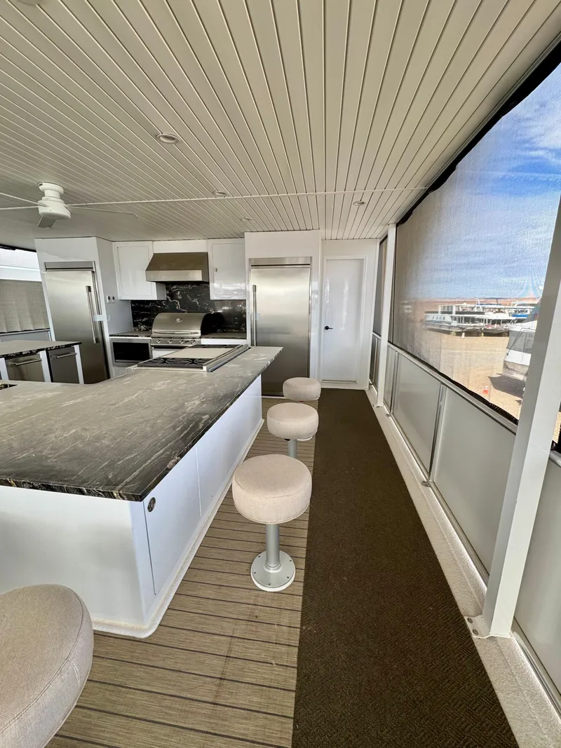 Slide: The Image of Modern kitchen interior on Adonia Cosmos Trip #11, 2024, featuring sleek countertops and bar stools. - 30