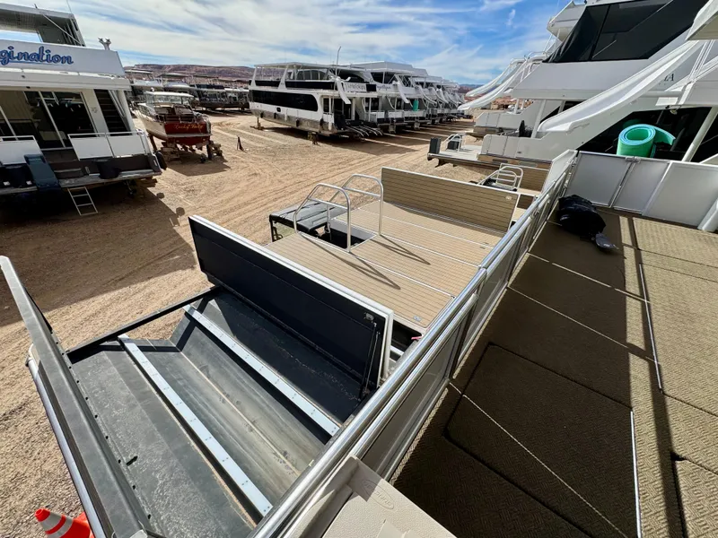 Slide: The Image of Boats docked on sandy shore, featuring Adonia Cosmos Trip #11, 2024 model. - 5