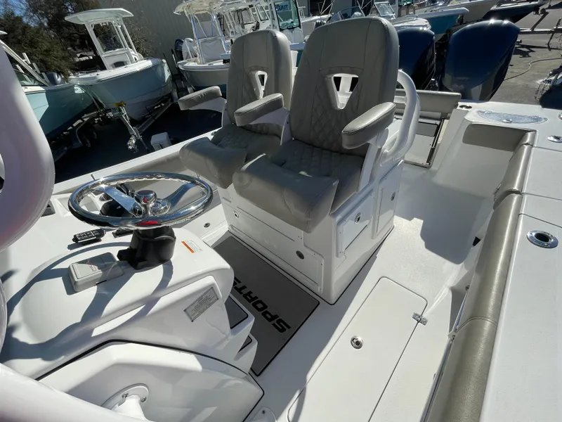 Slide: The Image of 2021 Sportsman Open 282 Center Console boat interior with dual seats and steering wheel. - 10