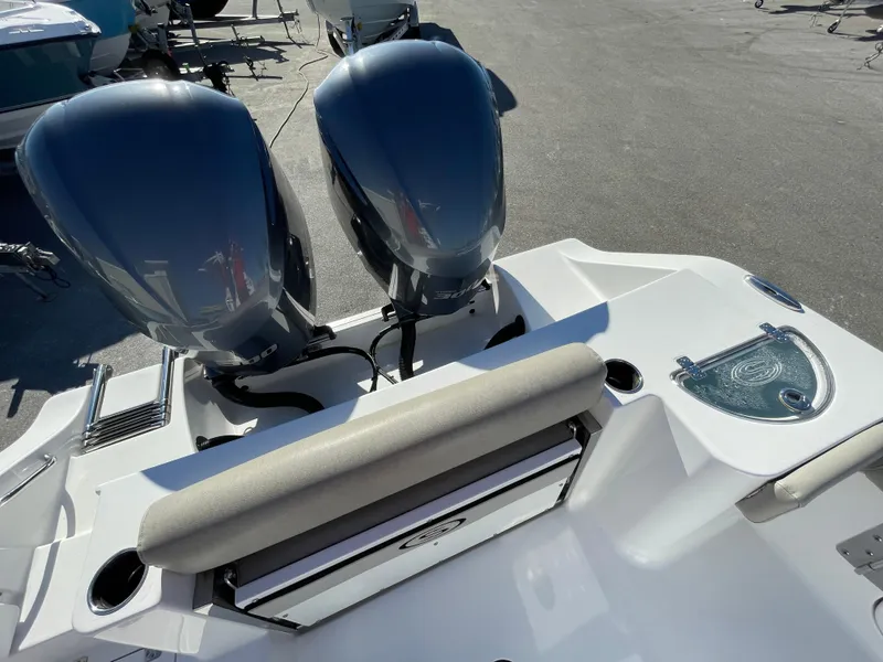 Slide: The Image of 2021 Sportsman Open 282 Center Console with dual engines, rear seating, and sleek design. - 13