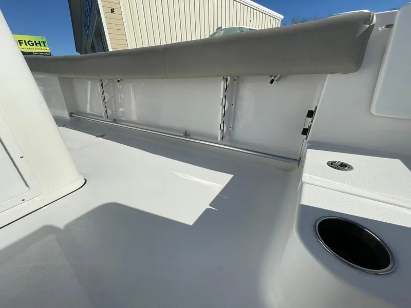 Slide: The Image of 2021 Sportsman Open 282 Center Console boat interior, featuring seating and cup holder. - 14