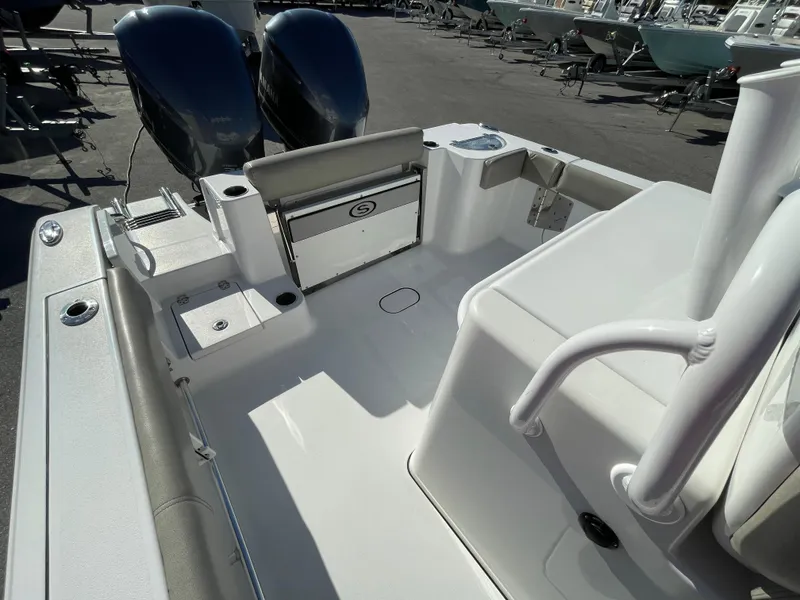 Slide: The Image of 2021 Sportsman Open 282 Center Console boat interior with dual engines. - 15
