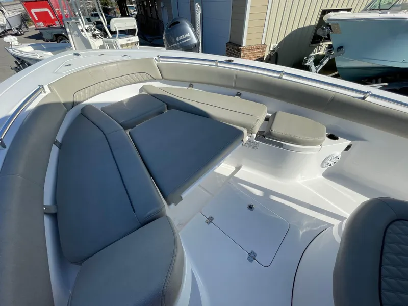 Slide: The Image of 2021 Sportsman Open 282 Center Console boat interior with cushioned seating. - 4