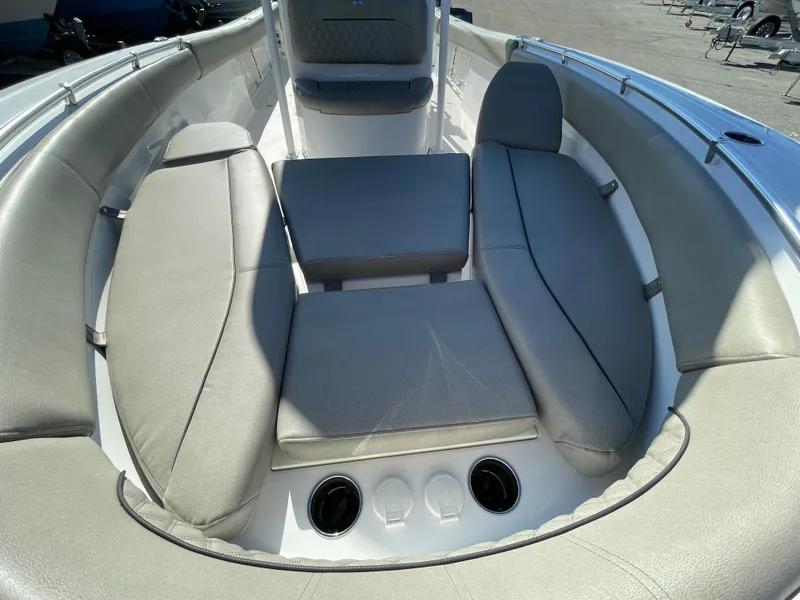 Slide: The Image of 2021 Sportsman Open 282 Center Console boat interior with cushioned seating. - 5