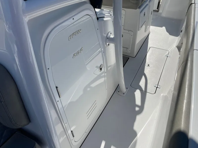 Slide: The Image of 2021 Sportsman Open 282 Center Console interior, featuring storage compartments and sleek design. - 8
