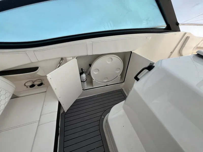 Slide: The Image of 2020 Sea Ray Sundancer 320 interior with open storage compartment and sleek design. - 11