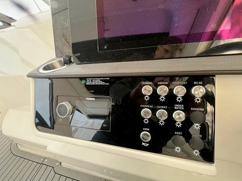 Slide: The Image of Control panel of 2020 Sea Ray Sundancer 320 boat with various function buttons. - 14