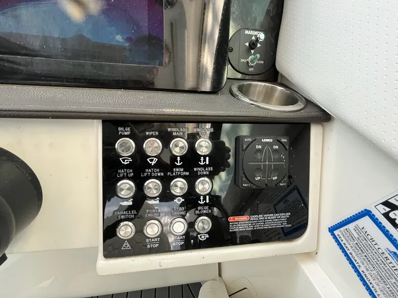 Slide: The Image of Control panel of a 2020 Sea Ray Sundancer 320 boat with various switches and buttons. - 15