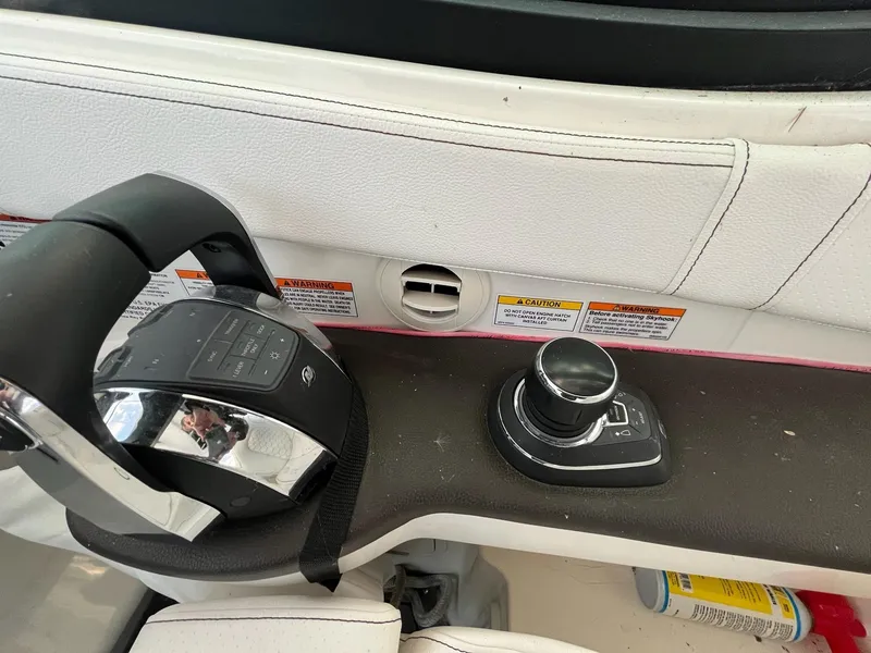 Slide: The Image of Control panel of a 2020 Sea Ray Sundancer 320 boat with joystick and throttle. - 16