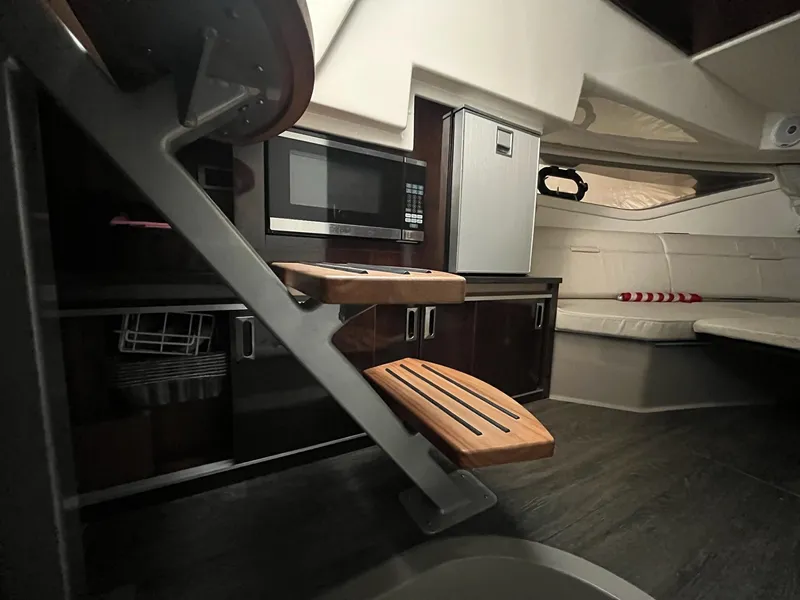 Slide: The Image of Interior of 2020 Sea Ray Sundancer 320 yacht with modern kitchen and seating area. - 19