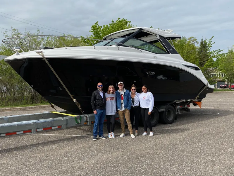 Slide: The Image of Group posing with 2020 Sea Ray Sundancer 320 boat on trailer. - 2