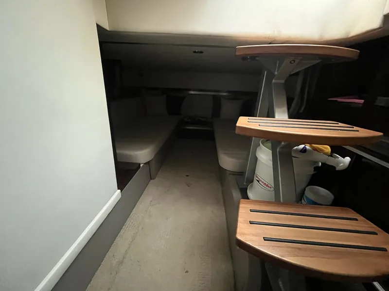 Slide: The Image of Interior cabin of 2020 Sea Ray Sundancer 320 with wooden steps and seating area. - 25