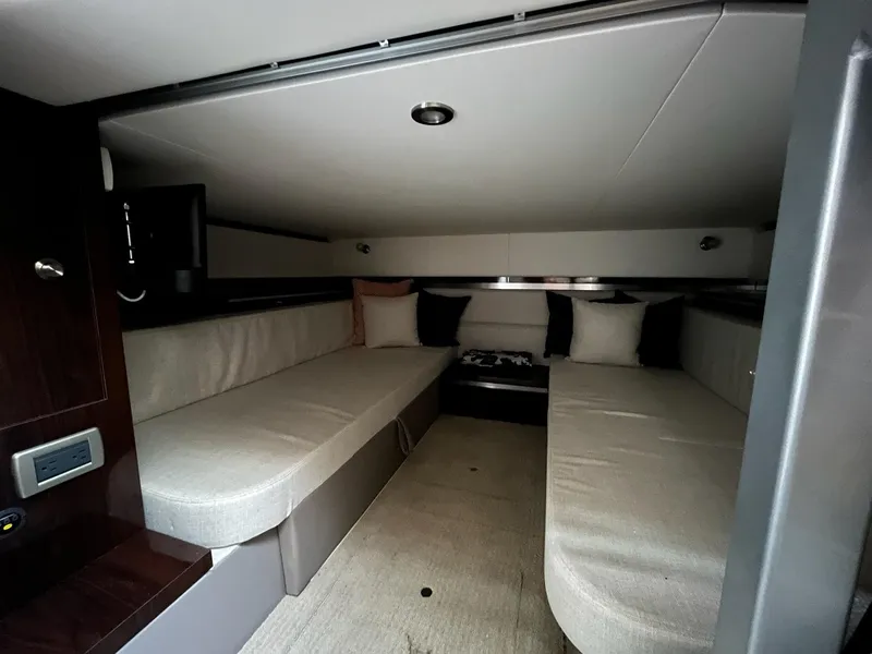 Slide: The Image of 2020 Sea Ray Sundancer 320 cabin interior with cozy seating and modern design. - 26