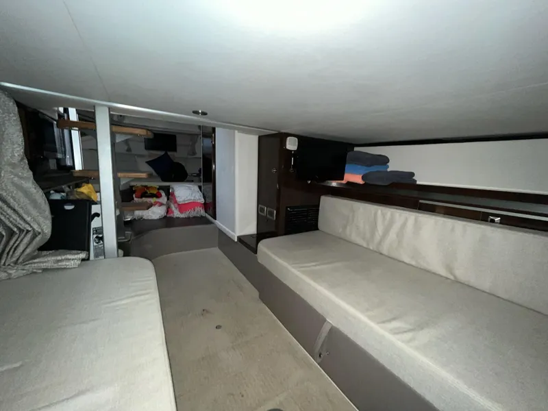 Slide: The Image of Interior cabin of 2020 Sea Ray Sundancer 320 with seating and storage. - 27