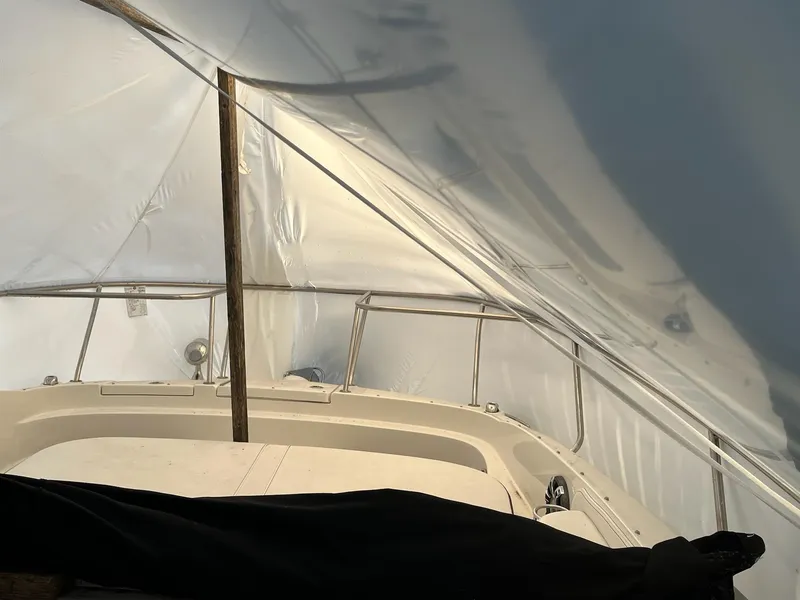 Slide: The Image of 2020 Sea Ray Sundancer 320 under protective cover, interior view. - 29
