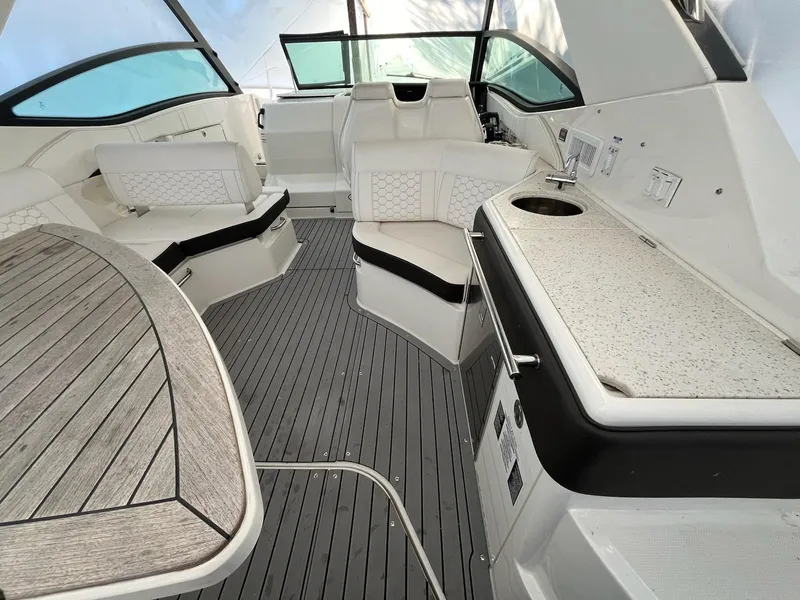 Slide: The Image of 2020 Sea Ray Sundancer 320 interior with sleek seating and modern amenities. - 3