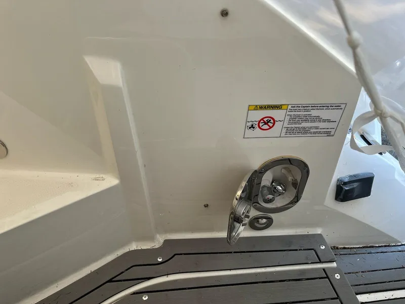 Slide: The Image of 2020 Sea Ray Sundancer 320 boat deck with warning label and metal fixture. - 33