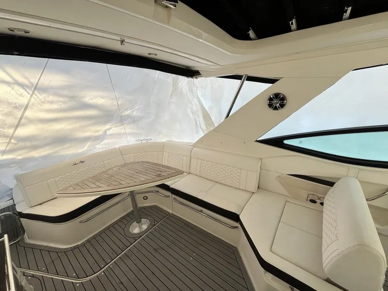 Slide: The Image of Luxurious interior of 2020 Sea Ray Sundancer 320 yacht with elegant seating and table. - 6