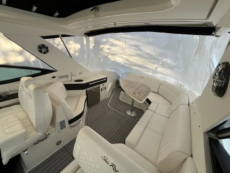 Slide: The Image of 2020 Sea Ray Sundancer 320 interior with white seating and modern design. - 9