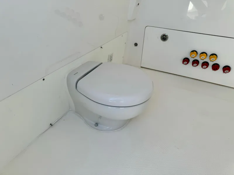 Slide: The Image of Toilet in 2020 Invincible 37 Catamaran interior with control panel. - 13