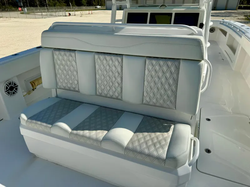 Slide: The Image of 2020 Invincible 37 Catamaran interior seating with diamond-stitched upholstery. - 17
